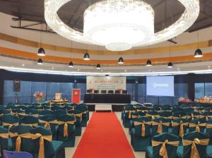 a conference hall with a red carpet and chairs at CLUB 21 by Sariska Fun City, Alwar in Mācheri