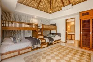 Un ou plusieurs lits dans un hébergement de l'établissement Villa Oceana, Candidasa