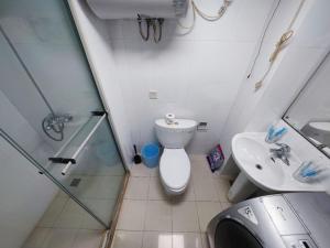 a bathroom with a shower and a toilet and a sink at iNestin Shanghai Apt Xinjinqiao Road in Shanghai
