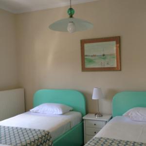Postel nebo postele na pokoji v ubytování Armonia House Potamos Village