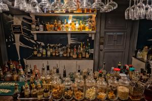 a bar filled with lots of bottles of alcohol at WHITE BANANA Manila - NEW in Manila