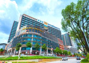 a large building with a sign on the side of it at Greystone Centrestage PJ in Petaling Jaya