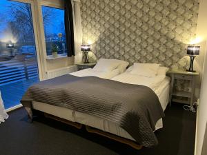 Postel nebo postele na pokoji v ubytování Björnlokan B&B