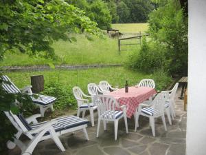 a table and chairs sitting on a patio at Haus Belluti Graun in Cortaccia