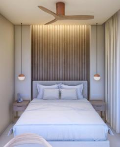 Posteľ alebo postele v izbe v ubytovaní AGRELLI Hotel & Suites