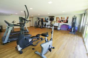a gym with several exercise bikes and tread machines at Sun Residence in Fortaleza