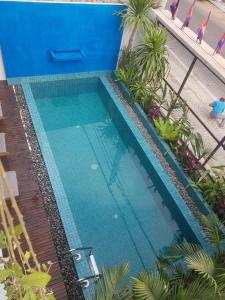 an overhead view of a swimming pool with blue water at Baahu Villa in Siem Reap