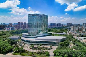 a large building in the middle of a city at Crowne Plaza Huizhou, an IHG Hotel in Huizhou