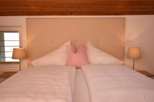 A bed or beds in a room at Alpine Active Weitgasser