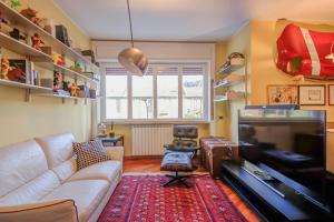 a living room with a couch and a chair at Design apartment in the design district of Milan in Milan