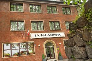 a building with a hotelalloallo sign in front of it at Hotel Allegro in Cologne