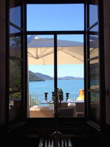 a window view of the water from a house at Castello Oldofredi in Monte Isola
