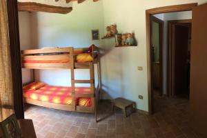 Postel nebo postele na pokoji v ubytování Cuore della Toscana