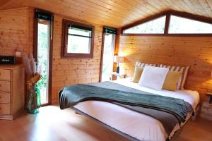 Posteľ alebo postele v izbe v ubytovaní Le Chalet - Les Lodges de Praly