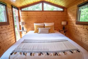 Posteľ alebo postele v izbe v ubytovaní Le Chalet - Les Lodges de Praly