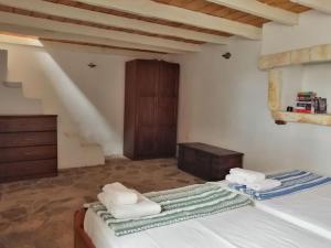 Postel nebo postele na pokoji v ubytování Looby's at Christos Leros