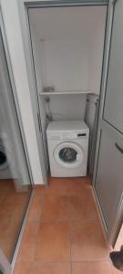 a small bathroom with a toilet in a room at VV Faro in Puerto de Mogán +6 photos