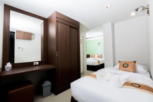 Postel nebo postele na pokoji v ubytování Royal Asia Hotel Pratunam