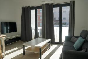 Telewizja i/lub zestaw kina domowego w obiekcie Apartamento Turistico Hermanos Infantes