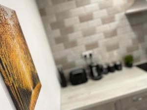 a kitchen counter with a stove top in a kitchen at Luxurious New 2 Bed Apartment in Burnley, Lancashire in Burnley