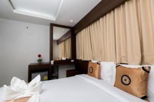 Postel nebo postele na pokoji v ubytování Royal Asia Hotel Pratunam