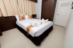 Postel nebo postele na pokoji v ubytování Royal Asia Hotel Pratunam