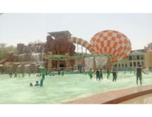 a group of people playing in a water park at Hotel Kanha Dham, Kanpur in Kānpur