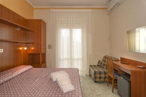 Postel nebo postele na pokoji v ubytování Hotel Dolly