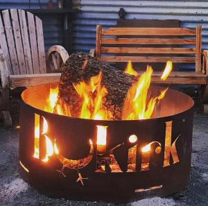 a large fire pit with the words bk on it at Bukirk Glamping & Fancy Coops in Clare