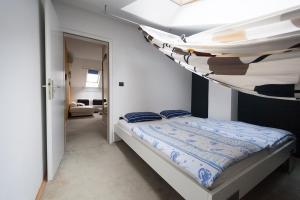 a bedroom with a bunk bed in a room at Centar W in Osijek
