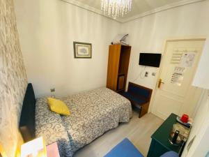 Postel nebo postele na pokoji v ubytování Pensión Antonio Guesthouse