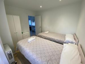 A bed or beds in a room at Acogedor Apartamento en zona privilegiada