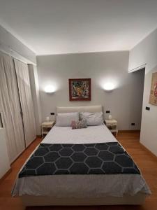 a bedroom with a large bed in a room at Suite Luxury [Duomo - SanSiro] in Milan