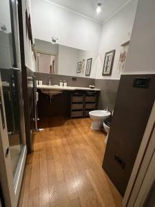 a bathroom with a sink and a toilet in it at Suite Luxury [Duomo - SanSiro] in Milan