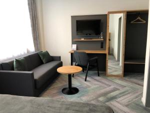 TV a/nebo společenská místnost v ubytování Budget Motel Self Check-In