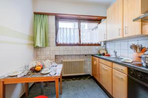 a kitchen with a table and a window in it at Top Of The Spots - Happy Rentals in Lugano