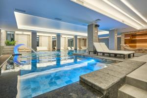 a swimming pool in the middle of a house at Fomich Residence in Bukovel