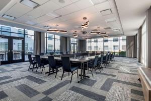 a large conference room with a long table and chairs at Cambria Hotel Portland Downtown Old Port in Portland
