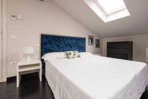A bed or beds in a room at Le Stanze di Gianmarmo - Via di Mezzo