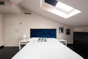 A bed or beds in a room at Le Stanze di Gianmarmo - Via di Mezzo