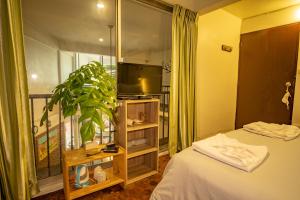 Postel nebo postele na pokoji v ubytování Home16 Sukhumvit16