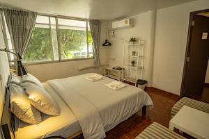 Postel nebo postele na pokoji v ubytování Home16 Sukhumvit16