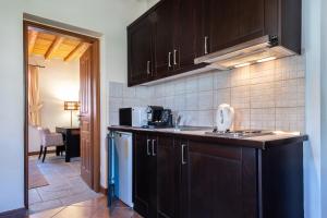 A kitchen or kitchenette at Lively Lofts by The Varos Residences