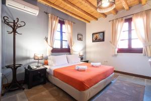 A bed or beds in a room at Lively Lofts by The Varos Residences
