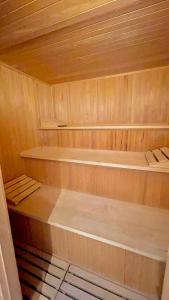 a wooden sauna with two bunk beds in it at Large holiday apartment with sauna, terrace, garden and open fireplace in Lenggries