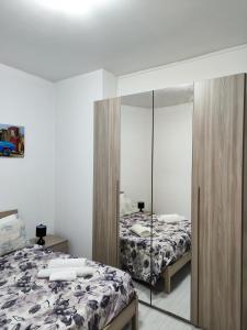 Posteľ alebo postele v izbe v ubytovaní Appartamento C&Y Torelli