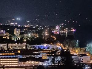 a view of a city at night with lights at Waterfront Karon Beach by PHR in Karon Beach