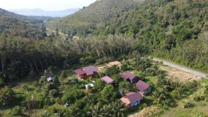an aerial view of a house in a forest at Green Mountain Resort Koh Yao in Ko Yao Yai