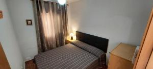 En eller flere senge i et værelse på Bungalow Magnolias 20 en Santa Pola