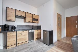 Kuchyňa alebo kuchynka v ubytovaní Apartamenty u Bratków